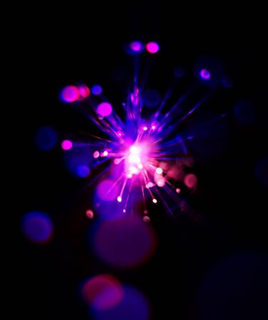 Colorful light explosion on black background. Futuristic wallpaperの写真素材