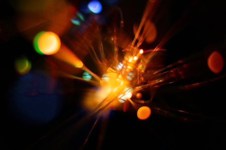 Colorful light explosion on black background. Futuristic wallpaperの写真素材