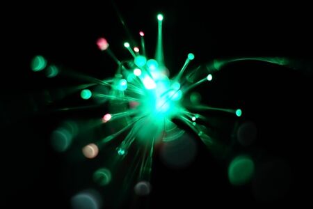 Colorful light explosion on black background. Futuristic wallpaperの写真素材
