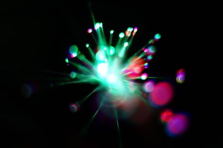 Colorful light explosion on black background. Futuristic wallpaperの写真素材