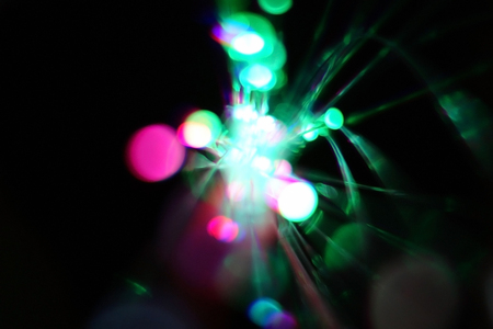 Colorful light explosion on black background. Futuristic wallpaperの写真素材