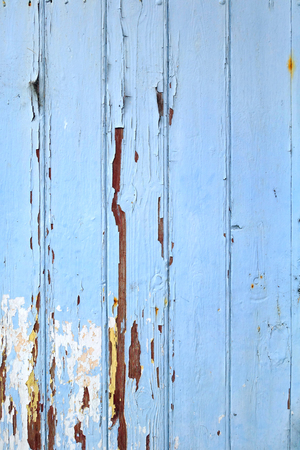 Old wood board painted blue background textureの写真素材