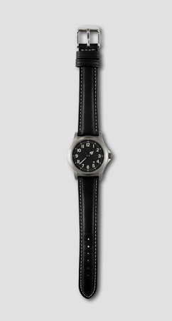 Black wrist watch isolated on grey backgroundの写真素材
