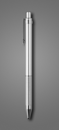 Steel metal pen isolated on dark grey backgroundの写真素材
