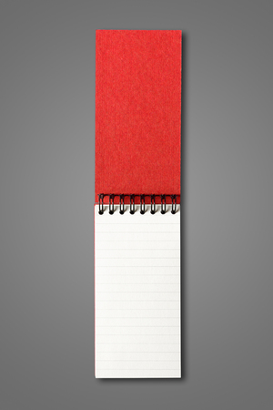 Blank open spiral notebook mockup isolated on dark greyの写真素材