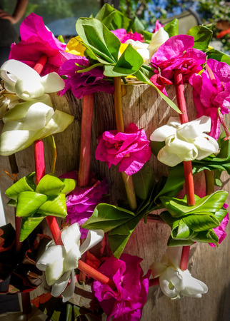 Traditional polynesian flower necklace on a wooden backgroundの写真素材