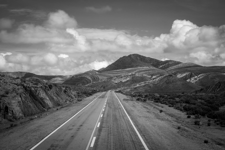 lost desert road in north Argentina quebrada - black and white pictureの写真素材