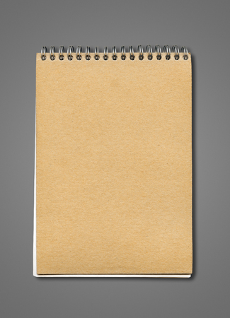 Spiral closed notebook mockup, brown paper cover, isolated on dark greyの写真素材