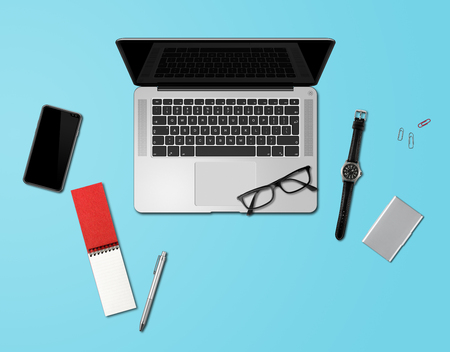 Modern office desk mockup top view isolated on blueの写真素材