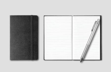 Black closed and open notebooks with pen isolated on grey backgroundの写真素材