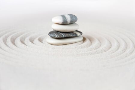 Black and white stones in the sand. Zen japanese garden background sceneの写真素材