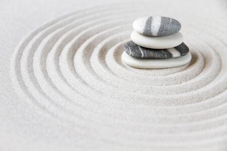 Black and white stones in the sand. Zen japanese garden background sceneの写真素材