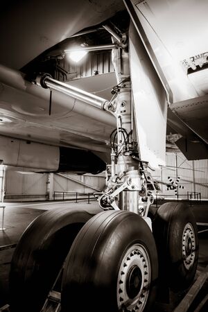 Commercial airplane landing gear detail. Black and white