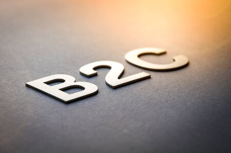 Word B2C written with white solid letters on a boardの写真素材