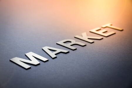 Word market written with white solid letters on a boardの写真素材