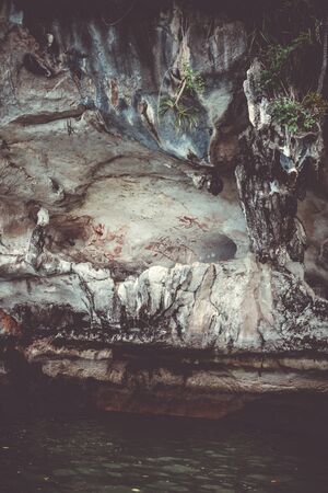 Prehistoric paintings on a cave wall, Phang Nga Bay, Thailandの写真素材