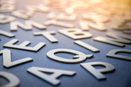 Mixed solid letters pile closeup photo. Education background conceptの写真素材