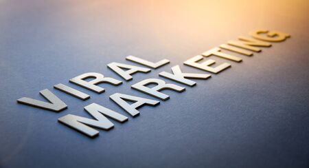 Word viral marketing written with white solid letters on a boardの写真素材