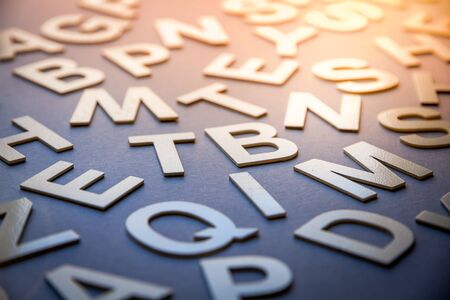 Mixed solid letters pile closeup photo. Education background conceptの写真素材