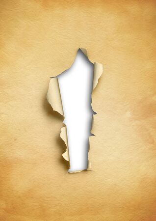 Old torn parchment paper with hole. blank background templateの写真素材