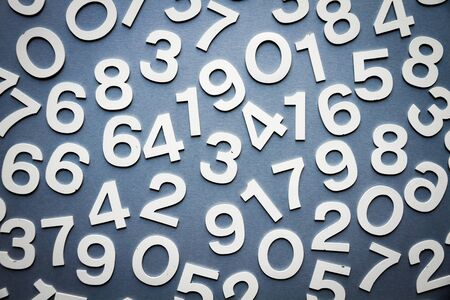 Mathematics background made with solid numbers on a boardの写真素材