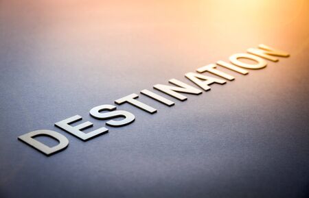 Word destination written with white solid letters on a boardの写真素材