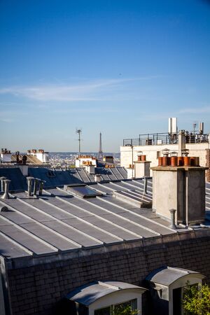 The traditional roofs of paris and the eiffel tower, Franceの写真素材
