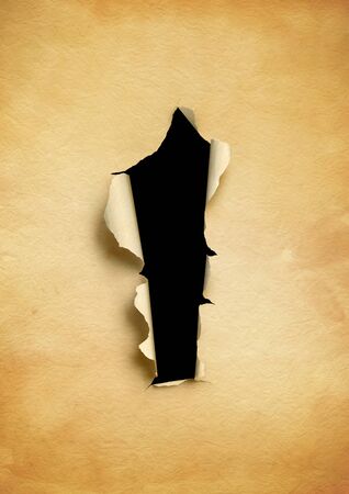 Old torn parchment paper with black hole. blank background templateの写真素材
