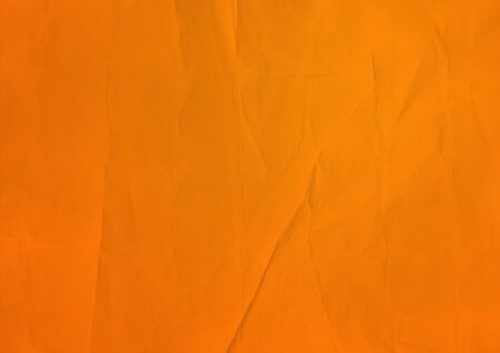 Old orange crumpled paper texture background. Wallpaperの写真素材