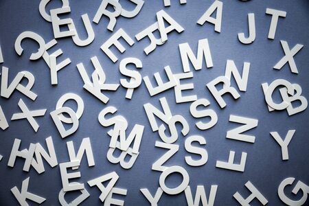 Mixed solid letters pile top view photo. Education background conceptの写真素材