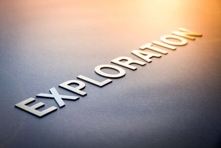 Word exploration written with white solid letters on a boardの写真素材