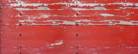 Old wood board painted red, banner background textureの写真素材
