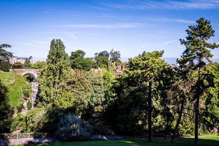 Sibyl temple and pond in Buttes-Chaumont Park, Paris, Franceの写真素材