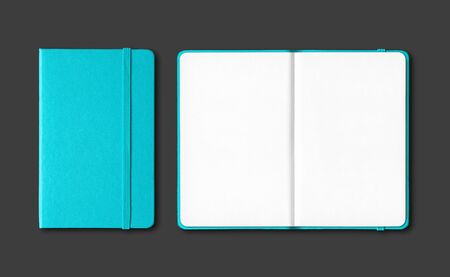 Aqua blue closed and open notebooks mockup isolated on blackの写真素材