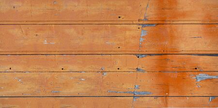 Old wood board painted orange, banner background textureの写真素材