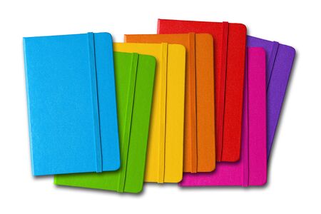 Multi color closed notebooks range isolated on whiteの写真素材