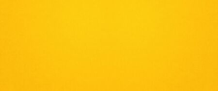 Yellow paper texture background. clean blank wallpaper bannerの写真素材