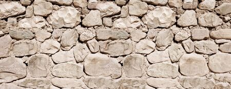 Old rough stone wall, banner background wallpaper                               の写真素材