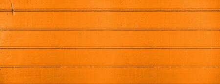 Old wood board painted orange banner background textureの写真素材