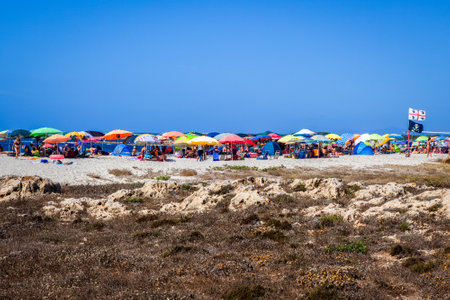 Sardinia/Italy - August 26, 2019 - Crowd of tourists on a beach in summerのeditorial素材