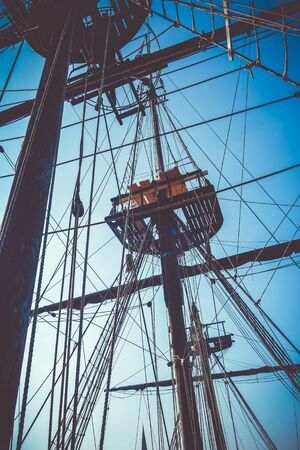 Old naval ship mast and sail ropes viewの写真素材