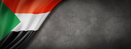 Sudan flag on concrete wall. Horizontal panoramic banner. 3D illustrationの写真素材