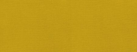 Yellow canvas texture background banner. Clean fabric wallpaperの写真素材