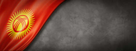 Kyrgyzstan flag on concrete wall. Horizontal panoramic banner. 3D illustrationの写真素材