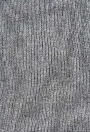 Grey knit wool texture background. Close up fabric wallpaperの写真素材