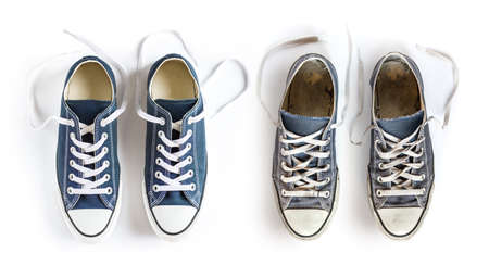 New and old blue generic sneakers isolated on white backgroundの写真素材