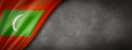Maldives flag on concrete wall. Horizontal panoramic banner. 3D illustrationの写真素材