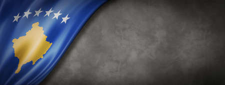 Kosovo flag on concrete wall. Horizontal panoramic banner. 3D illustrationの写真素材