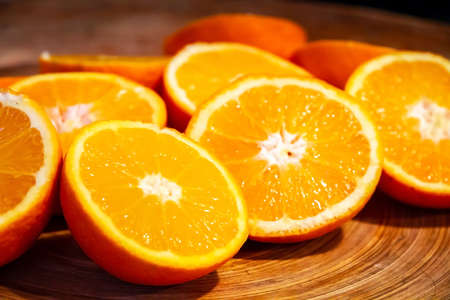 Bunch of fresh organic sliced oranges on a trayの写真素材