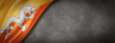 Bhutan flag on concrete wall. Horizontal panoramic banner. 3D illustrationの写真素材
